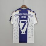 e59a87d1_11525139-27c8-4b4f-a412-3db6f797e2f2 | UAE SPORT STORE Autographed blue-and-white football jersey on a wooden hanger, displaying 'COPA EUROPA 1998' text and signatures.