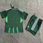 Green Adidas soccer jersey with lime-green side panels and matching shorts laid flat on a gray surface.