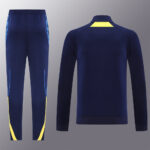 e700d55f | UAE SPORT STORE Navy blue athletic tracksuit set with bright yellow trim: pants show yellow panels at the cuffs and side stripes, jacket features a yellow accent at the back collar area.