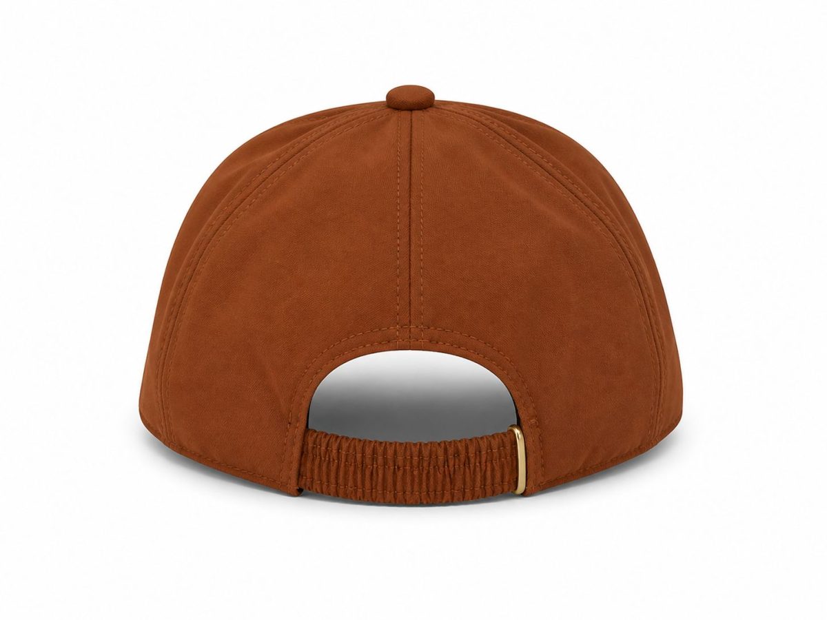 Back view of a brown suede baseball cap with an elastic strap and small gold buckle at the back surface styling stitches visible along the panels.