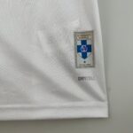 e733f73b_5c4a61ef-92fe-4383-8b48-734272b085d7 | UAE SPORT STORE Close-up of white fabric with a small Olympique de Marseille badge sewn onto the sleeve.