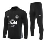 Black long-sleeve training top with quarter-zip and matching black pants; features white sponsor text 'Asahi 0.0%', Puma logos, and a circular team crest on the chest.