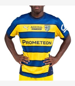 Male model wearing a blue and yellow striped Parma Calcio football jersey with sponsor Prometeon on the chest.