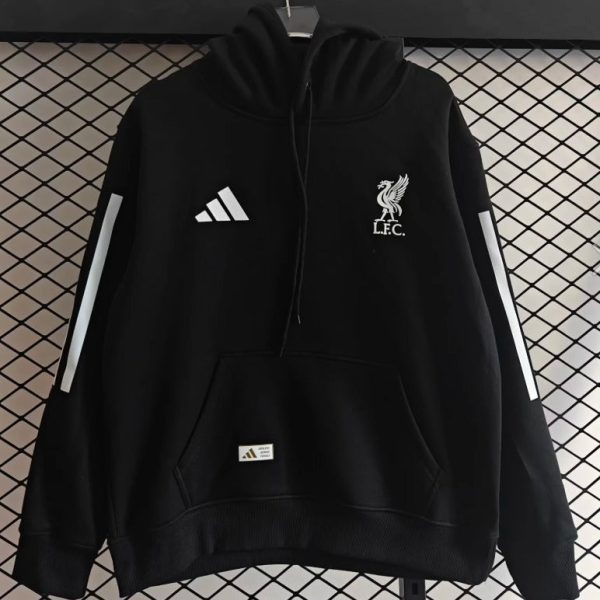 Black hoodie with white Liverbird crest and 'L.F.C.' on the chest, and Adidas logo on the left chest, displayed against a grid backdrop.