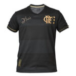 Black Flamengo football jersey with gold crest and stars, gold sleeve trim, and a left-chest autograph.