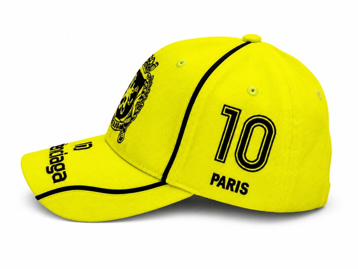 Bright yellow baseball cap with black piping, '10' and 'PARIS' on the side, and a crest on the front panel.