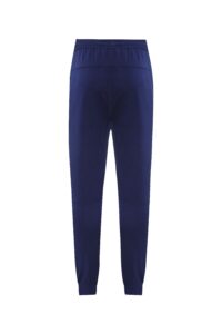 Back view of dark blue jogger pants with elastic waistband and cuffs at the ankles
