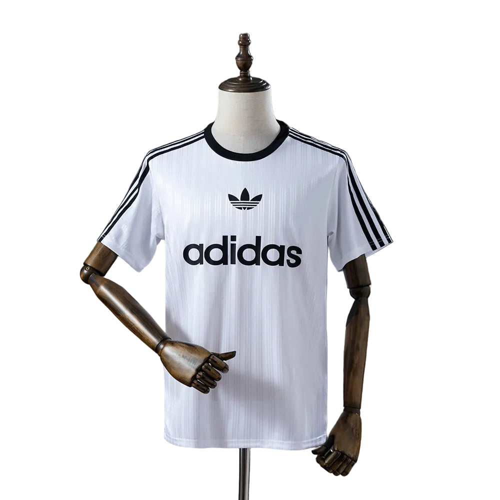 ed764667 White Adidas T-shirt on a mannequin with black trefoil logo and three black stripes along sleeves.