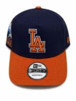 LA Dodgers Sunset Cap with adjustable strap, navy blue and orange design.