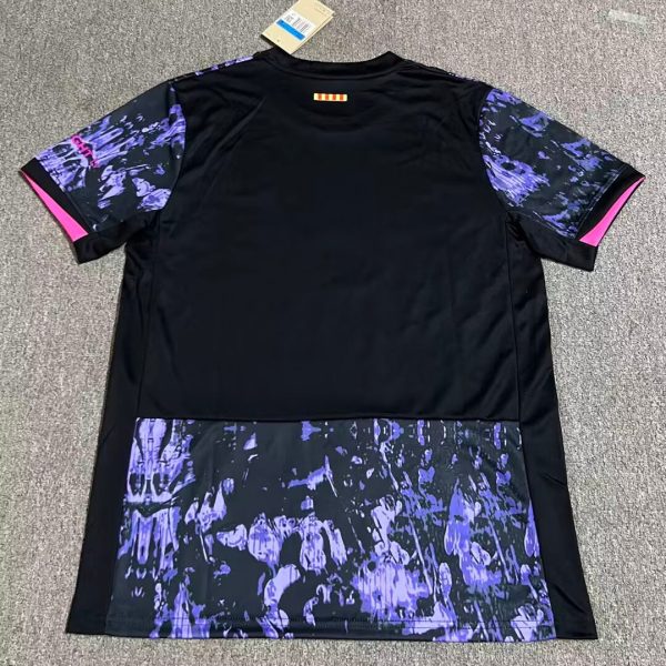 Black athletic shirt with purple marbled sleeves and a purple-patterned lower panel, pink trim at sleeve ends, tag attached at the collar area.