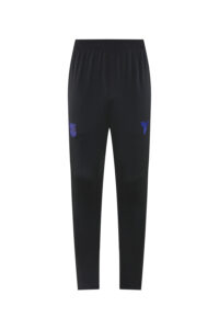 Black athletic jogger pants with an elastic waistband and blue crest logos on each thigh, tapered at the ankles.