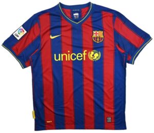 Barcelona FC football jersey with red and blue vertical stripes, UNICEF logo in yellow across the chest, crest on the left chest, Nike swoosh on the right, LFP patch on the sleeve.