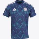 Blue Leicester City football jersey with teal geometric pattern, Adidas logo, and club crest on chest.