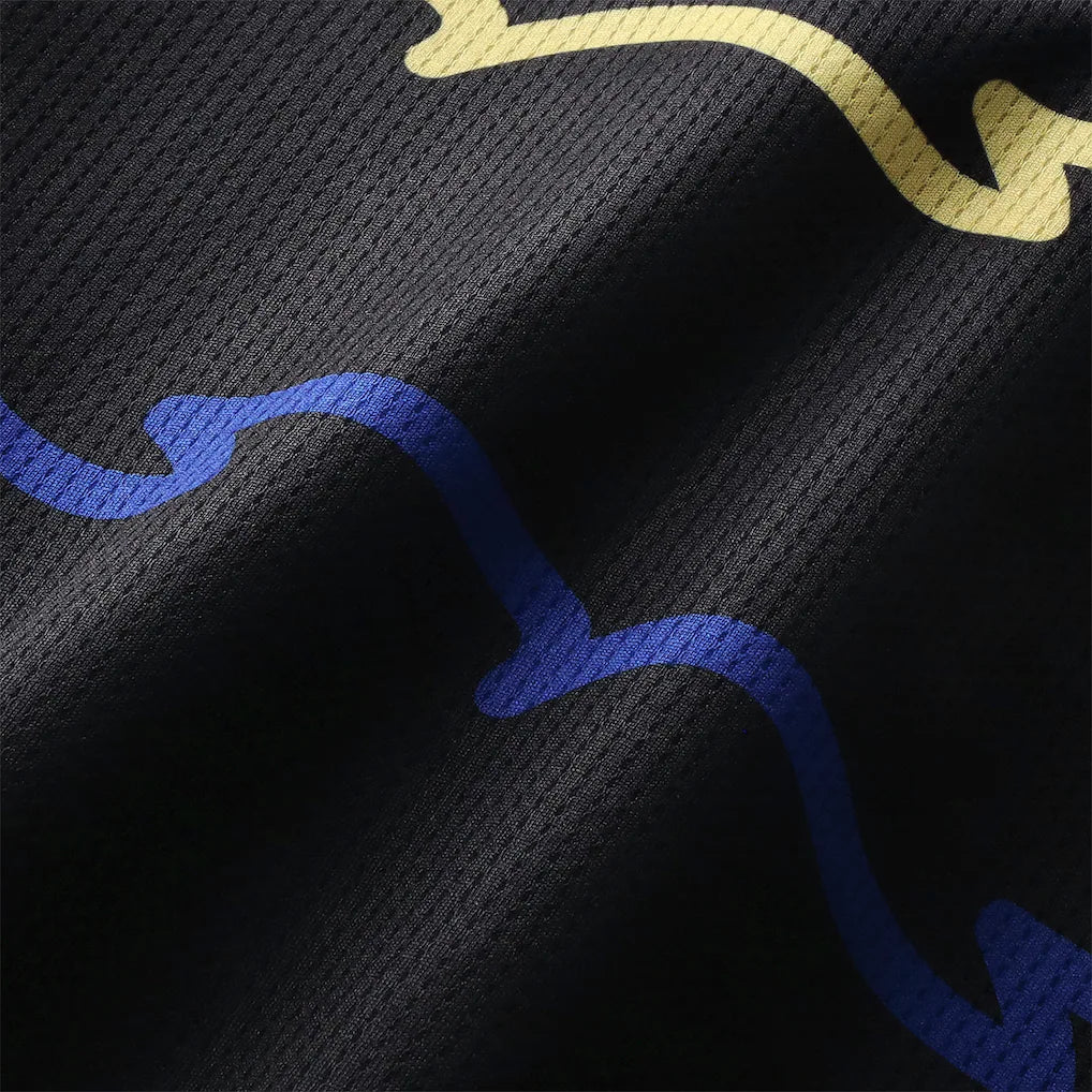 everton-castore-third-replica-shirt-2025-26_ss5_p-202445308_pv-6_u-v9o6w4cy3jqjtijkkyif_v-y12brl95fodwgso6dyg1 | UAE SPORT STORE Close-up of black fabric with abstract blue and yellow wavy lines.