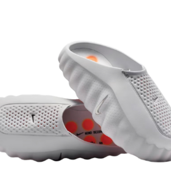 White perforated slip-on athletic shoe with a flexible ridged sole, designed for breathable comfort.