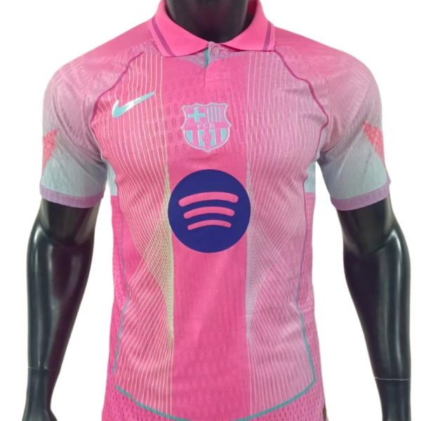 Pink FC Barcelona soccer jersey on a mannequin, featuring a Nike swoosh, club crest, and a Spotify logo on the front.