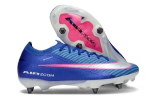Blue Nike soccer cleat with pink swoosh and exposed pink Zoom Air plate on the sole, white studs visible at the bottom.