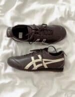 Vintage Onitsuka Tiger Mexico 66 SD sneakers in black with white accents. Classic design inspired by.