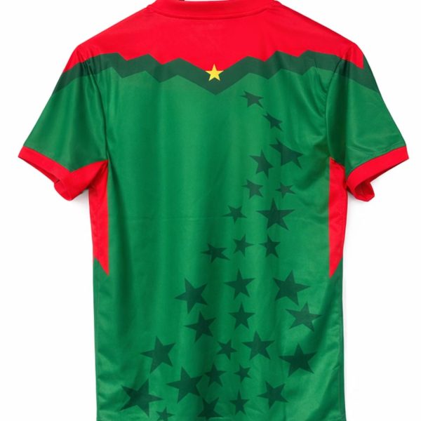 Back view of a red-and-green sports jersey on a wooden hanger, with a diagonal star pattern across the green body and red shoulders.