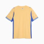 Back view of a yellow soccer jersey with blue side panels and blue-and-white striped sleeve cuffs.