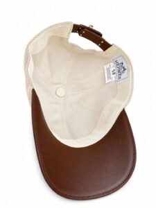 Brown leather baseball cap, interior lined in beige fabric with a mesh back panel and Hermes tag.