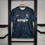 Chelsea FC home jersey on a hanger: navy blue with light blue splatter, BingX sponsor, Nike swoosh.