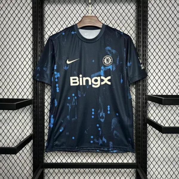 Chelsea FC home jersey on a hanger: navy blue with light blue splatter, BingX sponsor, Nike swoosh.
