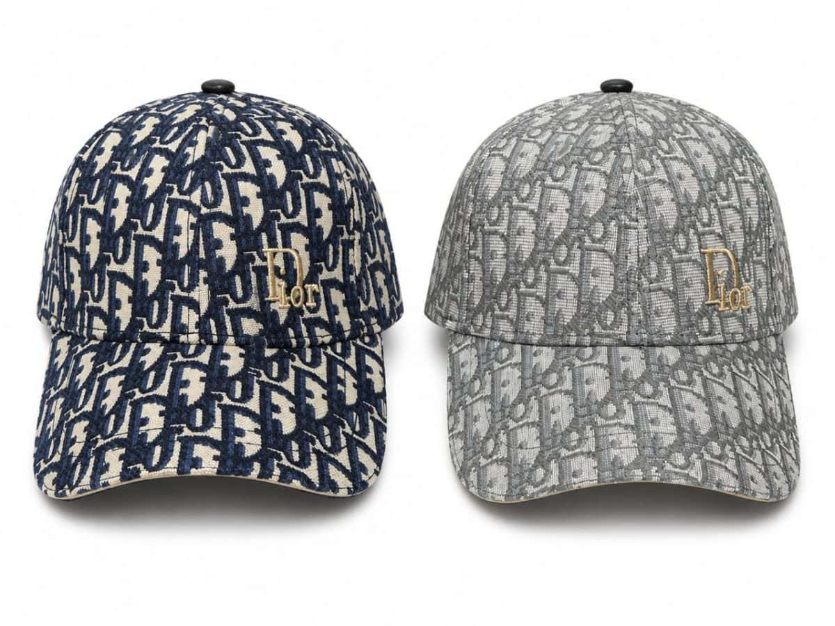 Two Dior monogram baseball caps in navy and gray, each with a gold Dior logo on the front.