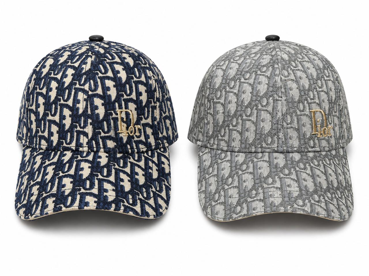 f88cc2d0-eba2-4257-99f1-055bf4ebe2c5 Two Dior monogram baseball caps in navy and gray, each with a gold Dior logo on the front.