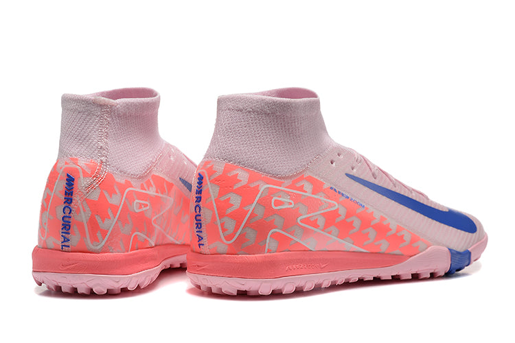 fa15e762 | UAE SPORT STORE Pair of pink soccer cleats with a sock-like collar, peach geometric pattern, and blue Nike swoosh on the side.