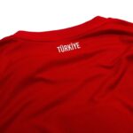 Close-up of red fabric with white text reading 'TÜRKİYE'.