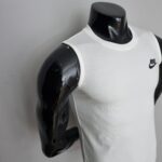 White Nike sleeveless shirt worn on a black mannequin torso, Nike swoosh logo visible on the chest area.