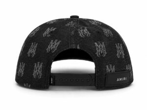 Back view of a black patterned baseball cap with an adjustable strap and an AMIRI patch label on the side.