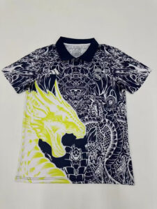 Navy polo shirt with a dense white dragon pattern and a neon-yellow dragon graphic across the front, Real Madrid crest on the chest.