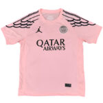 Pink Paris Saint-Germain soccer jersey with black wing-like shoulder pattern, sponsor text 'QATAR AIRWAYS', and club crest on chest.