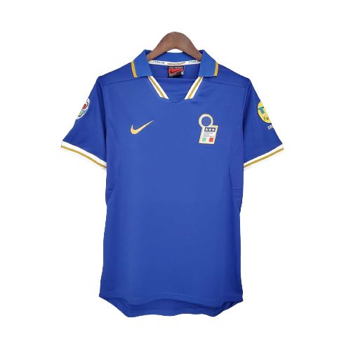 Blue soccer jersey on a hanger with a yellow Nike swoosh and an Italian crest on the left chest.