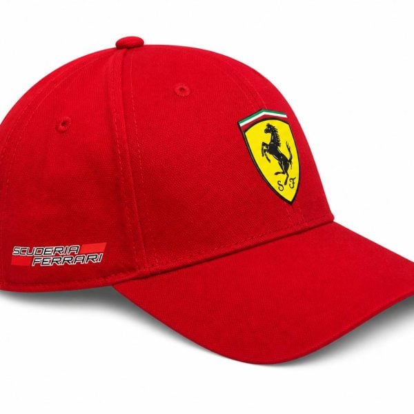 Red Ferrari cap with a yellow shield logo featuring the black prancing horse on the front and 'Scuderia Ferrari' text on the side.