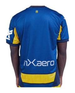 Back view of a blue athletic jersey with yellow panels and the NX.aero logo across the lower back.