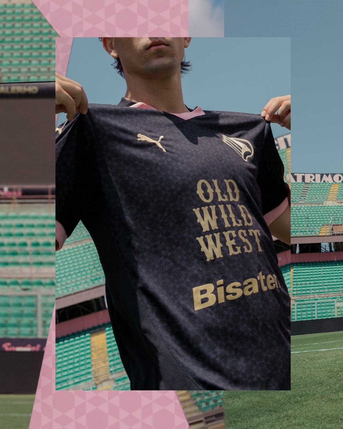 Man wearing a dark sports jersey with 'OLD WILD WEST' text and logos, standing in a stadium with green seats behind him.