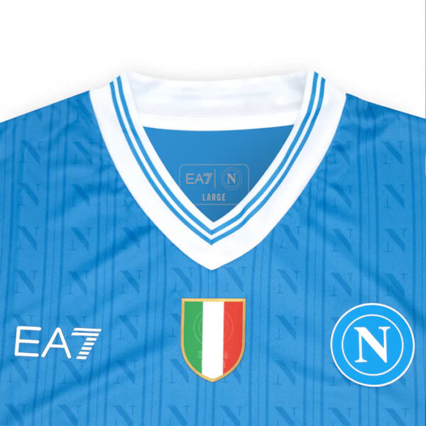 Blue Napoli football jersey with white collar, EA7 logo, and Italian flag crest.