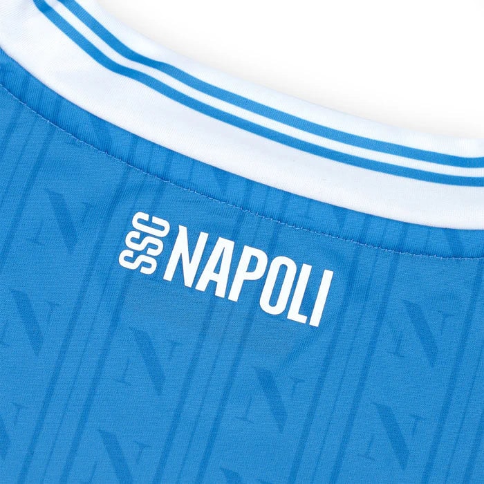 home-shirt-replica-1600-x-1600-px_08 | UAE SPORT STORE Close-up of a blue SSC Napoli soccer jersey collar with white stripes and the 'SSC NAPOLI' logo.
