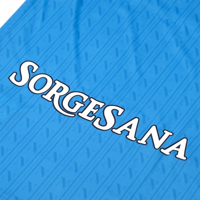 home-shirt-replica-1600-x-1600-px_09 | UAE SPORT STORE Brand logo with the word SORGESANA in white letters on a blue patterned background.