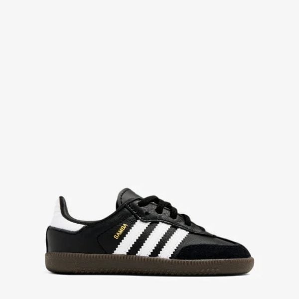 Black Adidas Samba sneaker with white 3 stripes and brown sole, side view.