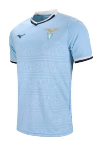 Light blue Lazio football jersey with white collar, crest on chest and Mizuno logo on the opposite side. Features subtle repeating Lazio pattern across the front.