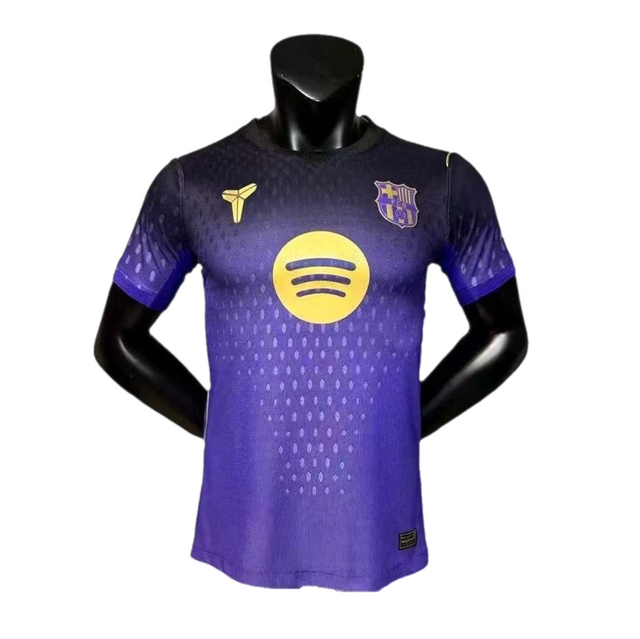 Purple FC Barcelona soccer jersey on a mannequin with a yellow Spotify logo center and club crest on the chest