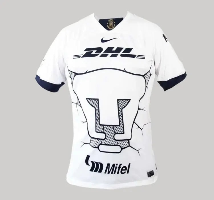 img_0303-1_13ca13b9-bc2c-48a5-92d2-bc2cd27b2ac4 | UAE SPORT STORE White athletic jersey on display with a large stylized U graphic and sponsor logos DHL and Mifel, Nike swoosh above the chest.