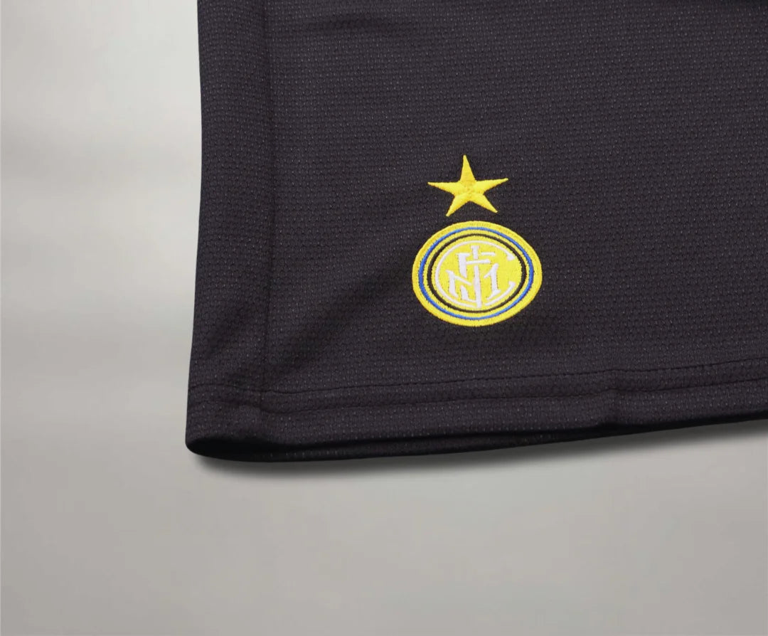 inter_97_Third_2 | UAE SPORT STORE Close-up of a dark sports jersey hem with the yellow Inter Milan crest and star above it