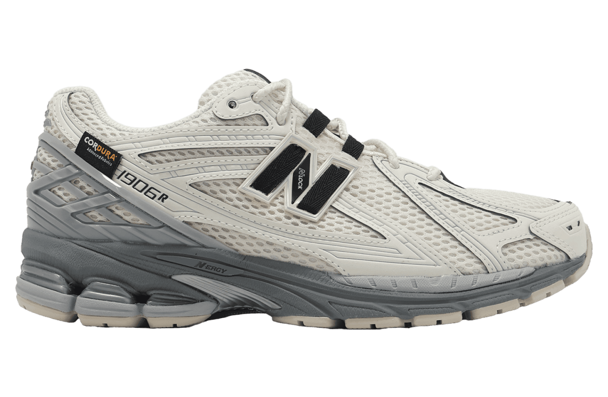 White/gray trail running shoe with mesh upper and chunky sole, NB logo on side (1906R) for men.