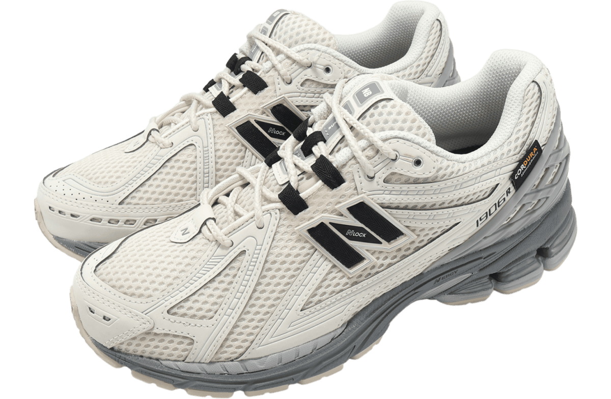Pair of white and light gray running shoes with breathable mesh upper and chunky gray sole.