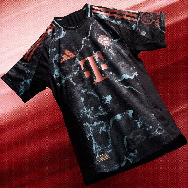 iwTN2EmC6ikGCQF | UAE SPORT STORE Black Bayern Munich football jersey with red-orange Telekom logo and Adidas stripes, featuring a blue-marble pattern and club crest.